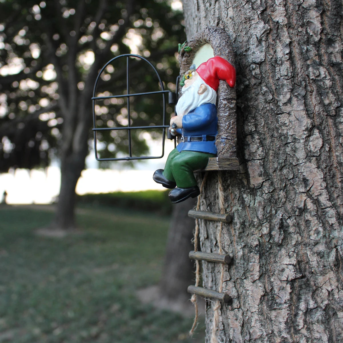 Outdoor 1 resin handicraft hanging from a dwarf playing piano tree, iron window, hanging tree, decorating courtyard tree trunks, hanging