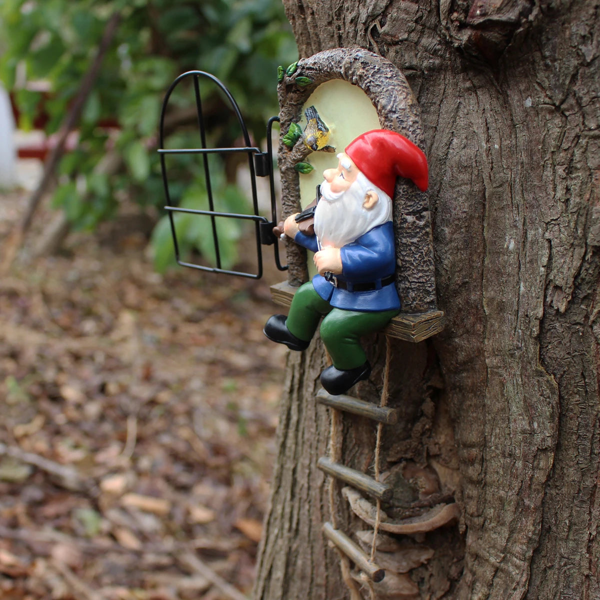 Outdoor 1 resin handicraft hanging from a dwarf playing piano tree, iron window, hanging tree, decorating courtyard tree trunks, hanging